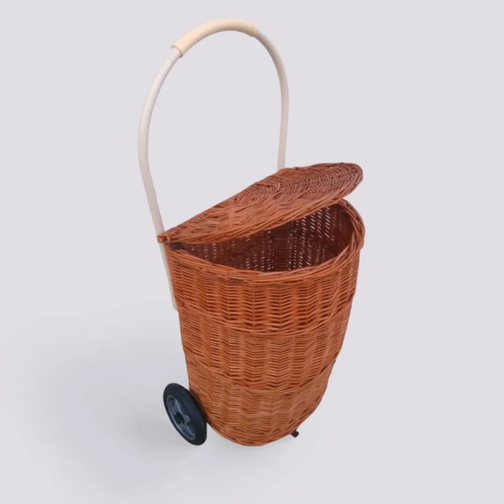 Brown natural wicker shopping basket on wheels