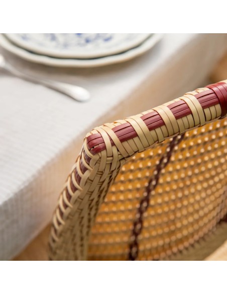 Close-up of the woven backrest on a resin chair with red netting – BELLE EPOQUE