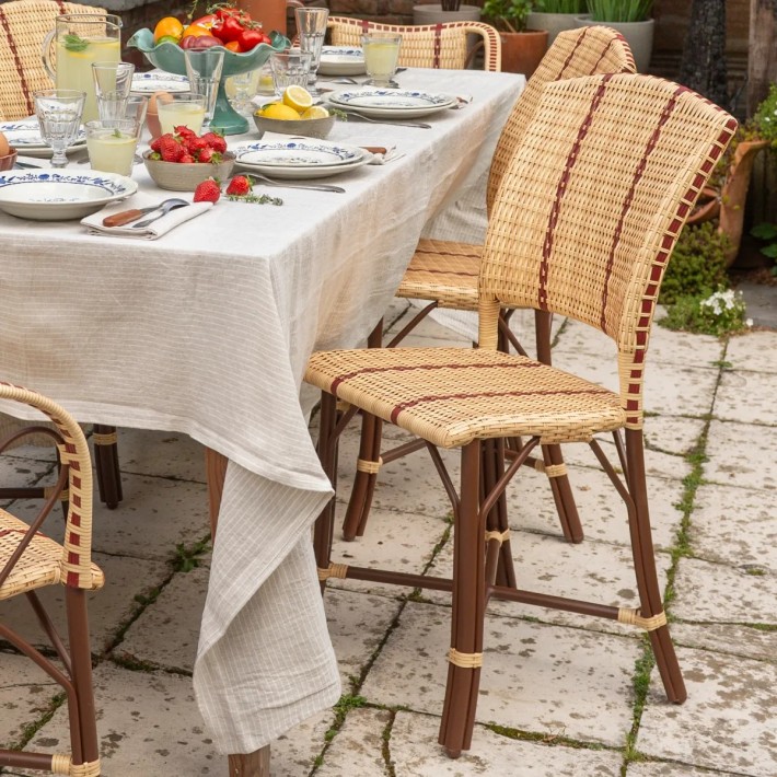 Resin garden chair around a BELLE EPOQUE table