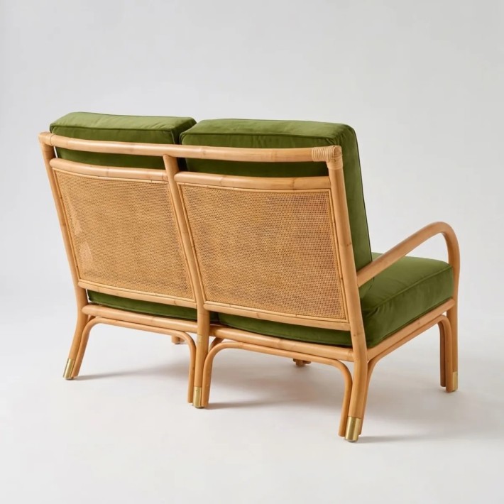 View of the rattan-woven backrest on the RIVIERA 2-seater sofa in green velvet fabric