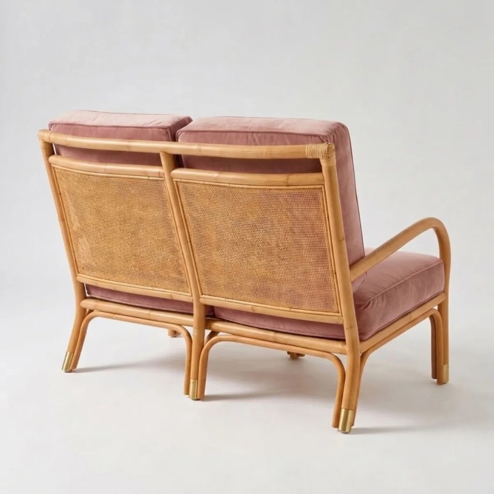 Rear view of the RIVIERA rattan sofa in pink velvet