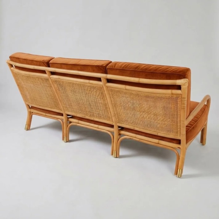 Rear view of a 3-seater rattan sofa from the RVIERA collection, in ochre velvet