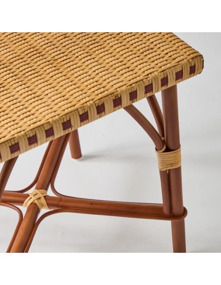 Close-up of the tabletop and legs of the BAGATELLE rattan coffee table